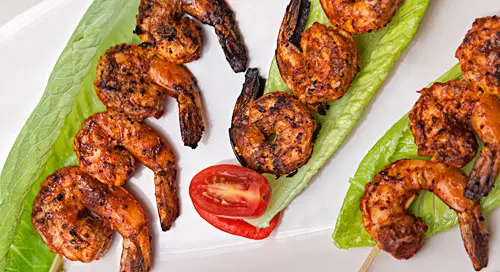 Achiote Shrimp Brochettes over lettuces