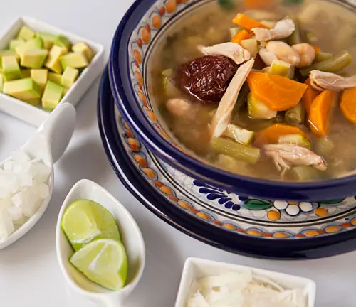 The Tlalpeno Soup accompanied with many ingredients