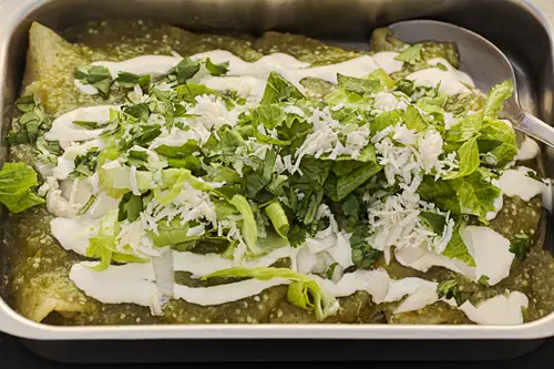 Green Enchiladas with Melted Cheese in the baking dish