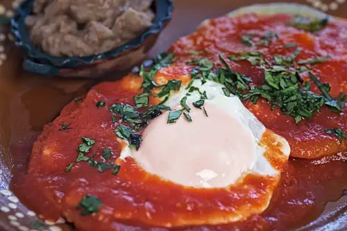 Ranch Style Eggs served with refried beans