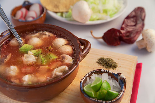 Vegetarian Red Pozole accompanied of many ingredients
