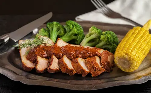 Pork in Adobo served with golden corn and broccoli