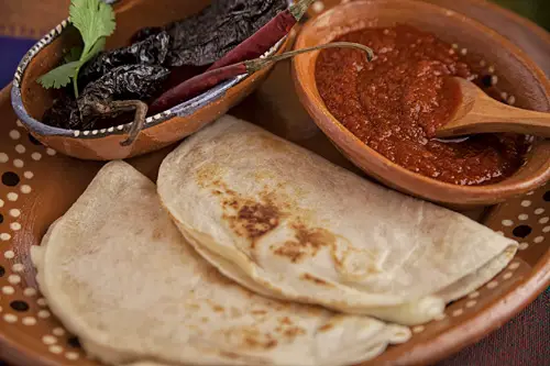 The Red Salsa with Morita Pepper served with quesadillas